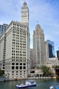 Wrigley Clock Tower and Tribune building beside Chicago river Royalty Free Stock Photo
