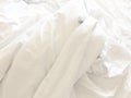 wrinkle messy blanket and white pillow in bedroom after waking up in the morning, from sleeping in a long night, details of duvet Royalty Free Stock Photo