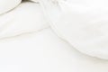 wrinkle messy blanket and white pillow in bedroom after waking up in the morning, from sleeping in a long night, details of duvet Royalty Free Stock Photo