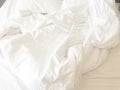 wrinkle messy blanket and white pillow in bedroom after waking up in the morning, from sleeping in a long night, details of duvet Royalty Free Stock Photo