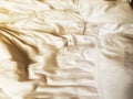 Wrinkle white soft blanket on the bed after wake up in the morning