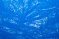 Wrinkled blue plastic sheet for background or text Royalty Free Stock Photo