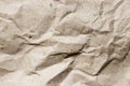 Wrinkled brown kraft paper textured background used as design element or decoration Royalty Free Stock Photo