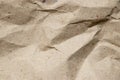 Wrinkled brown kraft paper textured background Royalty Free Stock Photo