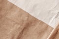 Wrinkled crumpled cardboard surface of two shades. Brown ang beige rough paper texture background, copy space Royalty Free Stock Photo