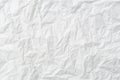 Wrinkled or crumpled white stencil paper or tissue after use with large copy space used for background texture in decorative art Royalty Free Stock Photo