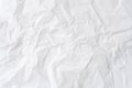 Wrinkled or crumpled white stencil paper or tissue paper after use with large copy space used for background texture in decorative Royalty Free Stock Photo