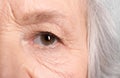 Wrinkled face of elderly woman, closeup Royalty Free Stock Photo