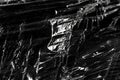 Wrinkled plastic wrap texture on a black background wallpaper Royalty Free Stock Photo