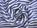 Wrinkled striped blue and white cotton or linen fabric, abstract horizontal background with crumpled wavy textile Royalty Free Stock Photo