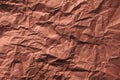 Wrinkled texture of crumpled brown craft paper as background Royalty Free Stock Photo