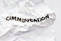 Wrinkled white paper with the word communication Royalty Free Stock Photo