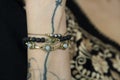 Wrist detail wearing collection of bracelets