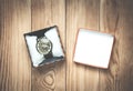 Wrist watch in box on the wood background. Royalty Free Stock Photo