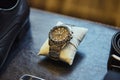 Wrist watch lie on table. Different accessories of businessman for creating style of  people on  wooden background Royalty Free Stock Photo