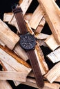 wrist watch men& x27;s brown leather strap on wood. Royalty Free Stock Photo