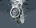 Wrist watch is splashing in water Royalty Free Stock Photo
