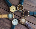 Wrist watches on a wooden table