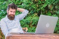 Write article for online magazine. Man looking for inspiration. Find topic write. Bearded hipster laptop surfing Royalty Free Stock Photo