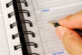 Write down what to do in the day planner Royalty Free Stock Photo