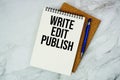 Write Edit Publish text written on notepad with pen on marble background Royalty Free Stock Photo