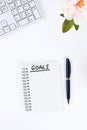 Write a goal for the new year 2020 in a white notebook