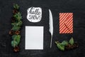 Write greetings. Envelope, paper, pen, hello snow hand lettering on black background top view pattern Royalty Free Stock Photo