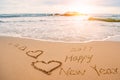 Write 2017 happy new year on beach with hearts