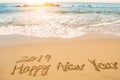 Write 2019 happy new year on beach