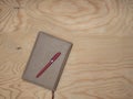 Notepad with wood table handle.