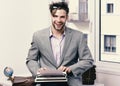 Writer or businessman wearing grey suit. Young author or editor Royalty Free Stock Photo