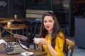 Writer female working in a coffee shop using a retro typewriter Royalty Free Stock Photo