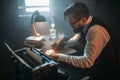 Writer in glasses writes novel with a feather Royalty Free Stock Photo