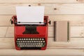 Writer or journalist workplace - vintage red typewriter on the wooden desk Royalty Free Stock Photo