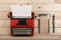 Writer or journalist workplace - vintage red typewriter on the wooden desk Royalty Free Stock Photo