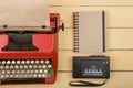 Writer or journalist workplace - vintage red typewriter on the yellow wooden desk Royalty Free Stock Photo