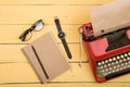 Writer or journalist workplace - vintage red typewriter on the yellow wooden desk Royalty Free Stock Photo