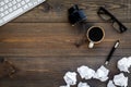 Writer profession. Retro concept. Computer, pen, inkpot, coffee near crumpled paper balls on dark wooden background top