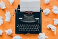 Writer`s block concept, top view of vintage typewriter machine and crumpled paper Royalty Free Stock Photo