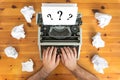 Writer`s block. Typewriter and crumpled paper on work desk. Creative process concept Royalty Free Stock Photo