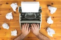 Writer`s block. Typewriter and crumpled paper on work desk. Creative process concept Royalty Free Stock Photo