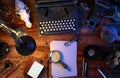 Writer`s desk table with typewriter, vintage phone, camera, skull, supplies, box of cigars. Top view. 3D illustration