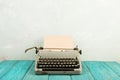 writer's workplace - wooden desk with typewriter