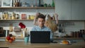 Writer working home laptop drinking coffee. Woman dancing watching on computer.