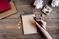 Writer workplace with tools on wooden background top view