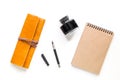 Writer workplace with vintage notebook on white background top view mockup