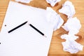 Writers block. a broken pencil and notepad surrounded by crumpled paper. Royalty Free Stock Photo