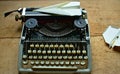 Writers block, Old typewriter on a antic wooden table with paper planes Royalty Free Stock Photo