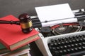 Writers desk - typewriter, books and judge's gavel, copyright protection law concept