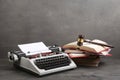 Writers desk - typewriter, books and judge's gavel, copyright protection law concept